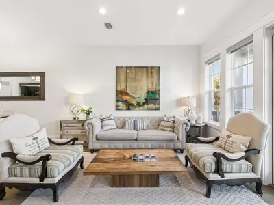a living room with a couch and two chairs and a table at CaSEAta by 30A Escapes in Rosemary Beach