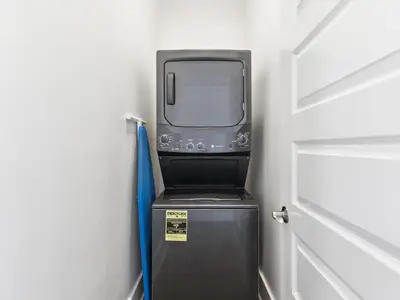 a tv sitting on top of a refrigerator in a room at CaSEAta by 30A Escapes in Rosemary Beach