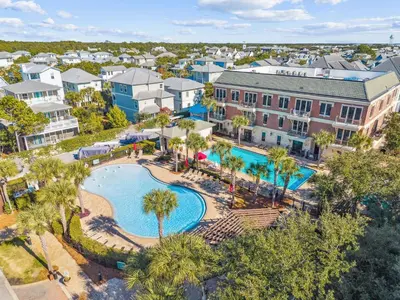 an aerial view of a resort with a pool and buildings at 275 Lifeguard Loop by 30A Escapes in Rosemary Beach