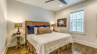 a bedroom with a bed and a window at Sail Away by 30A Escapes in Rosemary Beach