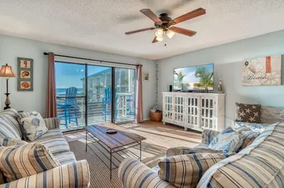 a living room with two couches and a ceiling fan at 350 Beachfront Trail Unit 4 by 30A Escapes in Seagrove Beach