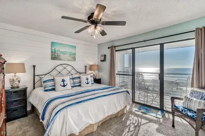 a bedroom with a bed and a ceiling fan at 350 Beachfront Trail Unit 4 by 30A Escapes in Seagrove Beach