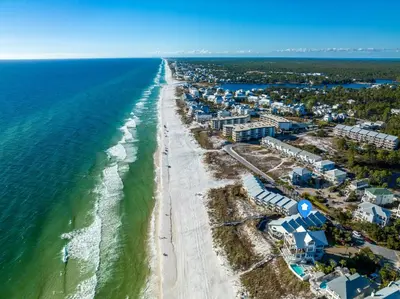 an aerial view of the beach and ocean at 350 Beachfront Trail Unit 4 by 30A Escapes in Seagrove Beach