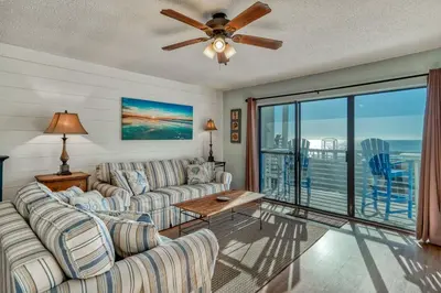 a living room with a couch and a ceiling fan at 350 Beachfront Trail Unit 4 by 30A Escapes in Seagrove Beach