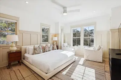 a white bedroom with a large bed and windows at HollieBird House by 30A Escapes in Watersound Beach