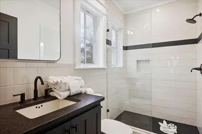 a bathroom with a sink and a toilet and a shower at HollieBird House by 30A Escapes in Watersound Beach