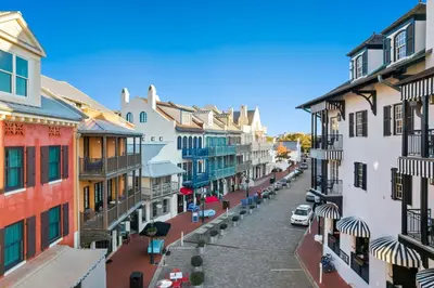 an empty street in a town with buildings at Rosemary Thyme by 30A Escapes in Rosemary Beach