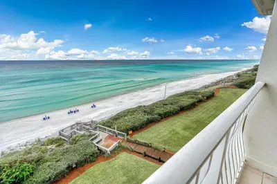 a view of the beach from the balcony of a condo at Castle in the Sand by 30A Escapes in Seacrest
