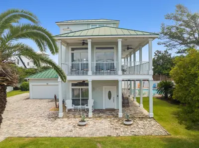 a large white house with a porch and a balcony at Shiloh by 30A Escapes in Seacrest