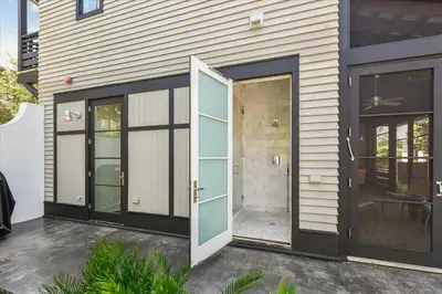 an open door of a house with a patio at Timeless by 30A Escapes in Rosemary Beach