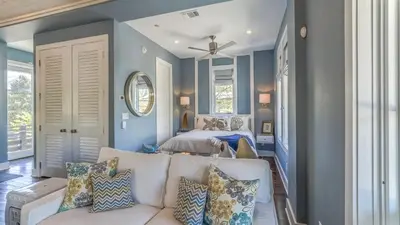 a living room with two beds and a couch at Timeless by 30A Escapes in Rosemary Beach