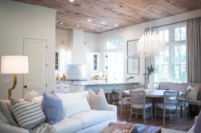 a living room with a white couch and a table at Amen Corner by 30A Escapes in Rosemary Beach