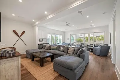 a living room with a couch and a table at High Noon by 30A Escapes in Rosemary Beach
