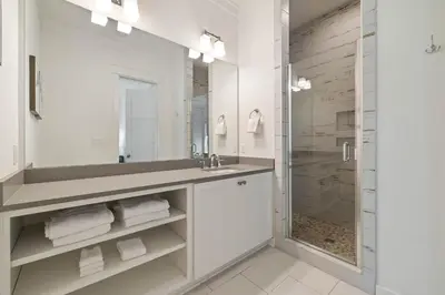 a bathroom with a sink and a shower at High Noon by 30A Escapes in Rosemary Beach