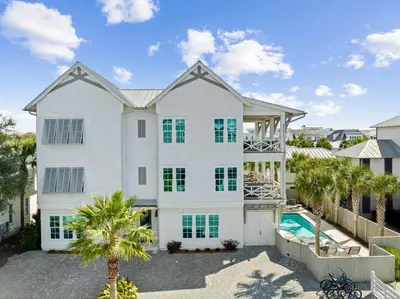 an aerial view of a white house with a swimming pool at High Noon by 30A Escapes in Rosemary Beach