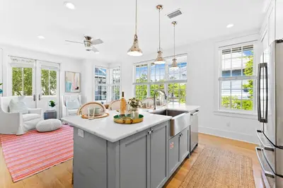 a kitchen with a sink and a counter top at Sands Cottage Carriage by 30A Escapes in Rosemary Beach