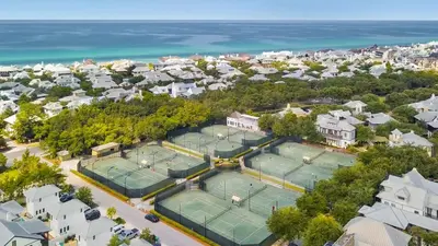 an overhead view of two tennis courts in a residential neighborhood at 6 Barrett Place by 30A Escapes in Rosemary Beach