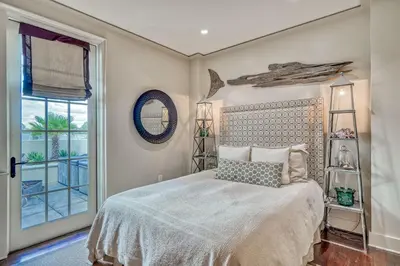 a bedroom with a bed and a window at 6 Barrett Place by 30A Escapes in Rosemary Beach