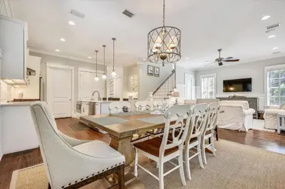 a kitchen and dining room with a table and chairs at Moon Landing by 30A Escapes in Watersound Beach