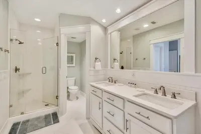 a bathroom with a sink and a shower and a toilet at Moon Landing by 30A Escapes in Watersound Beach