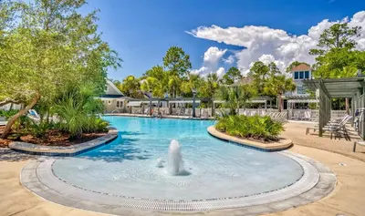 a pool at a resort with a fountain at Moon Landing by 30A Escapes in Watersound Beach