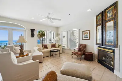a living room filled with furniture and a fireplace at Sunset Beach 202B by 30A Escapes in Rosemary Beach