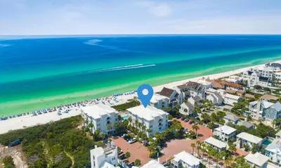 an aerial view of a beach with buildings and the ocean at Sunset Beach 202B by 30A Escapes in Rosemary Beach