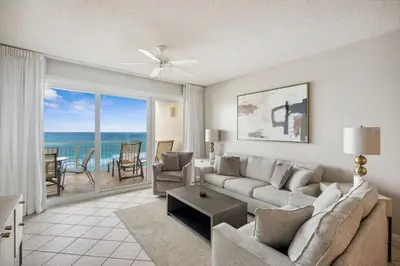 a living room with a couch and a view of the ocean at HP 34E On the Gulf by 30A Escapes in Rosemary Beach