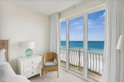 a bedroom with a bed and a view of the ocean at HP 34E On the Gulf by 30A Escapes in Rosemary Beach