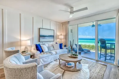 a living room with a couch and a table at HP 15W Salt and Light by 30A Escapes in Rosemary Beach