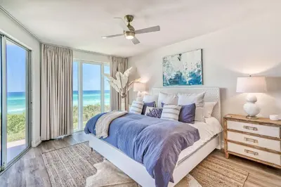 a bedroom with a bed with a view of the ocean at HP 15W Salt and Light by 30A Escapes in Rosemary Beach