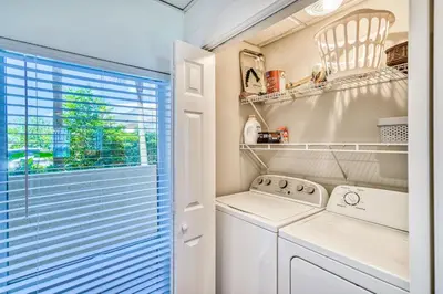 a laundry room with a washer and dryer at HP 15W Salt and Light by 30A Escapes in Rosemary Beach