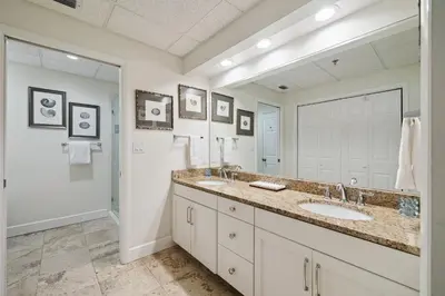 a bathroom with a sink and a large mirror at HP 16W Seadawg by 30A Escapes in Rosemary Beach