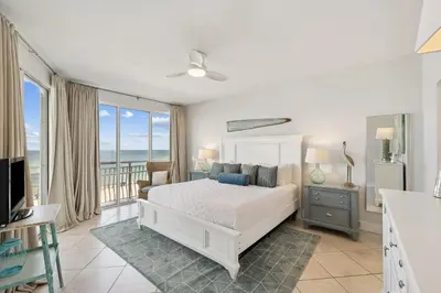a bedroom with a bed and a view of the ocean at HP 23W Calypso Crossing by 30A Escapes in Rosemary Beach