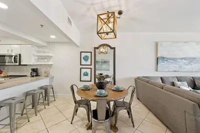 a living room with a couch and a table at HP 23W Calypso Crossing by 30A Escapes in Rosemary Beach