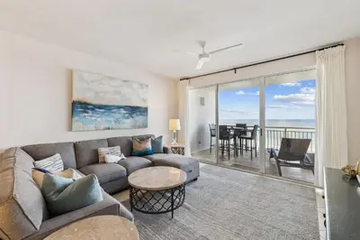 a living room with a couch and a table at HP 23W Calypso Crossing by 30A Escapes in Rosemary Beach