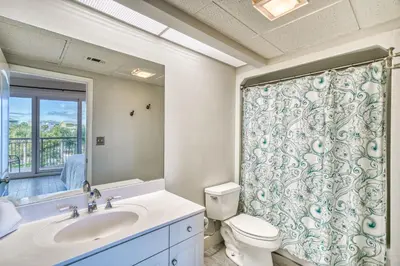 a bathroom with a sink and a toilet and a shower at HP 315 Condo by 30A Escapes in Rosemary Beach