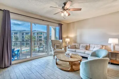 a living room with a couch and a table at HP 315 Condo by 30A Escapes in Rosemary Beach
