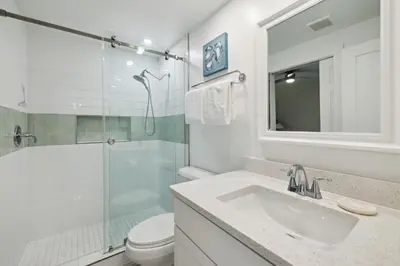 a bathroom with a sink and a shower and a toilet at HP 24W Condo by 30A Escapes in Rosemary Beach