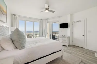 a bedroom with a bed with a view of the ocean at HP 24W Condo by 30A Escapes in Rosemary Beach