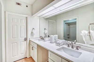 a bathroom with two sinks and a large mirror at HP 422 Blue Haven by 30A Escapes in Rosemary Beach