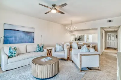 a living room with a couch and a table at HP 422 Blue Haven by 30A Escapes in Rosemary Beach