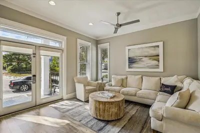 a living room with a couch and a coffee table at Makin Memories by 30A Escapes in Rosemary Beach