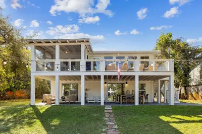 a home with a large white house at All Our Summers by 30A Escapes in Seagrove Beach