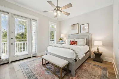 a bedroom with a bed and a ceiling fan at NamaStay by 30A Escapes in Seacrest
