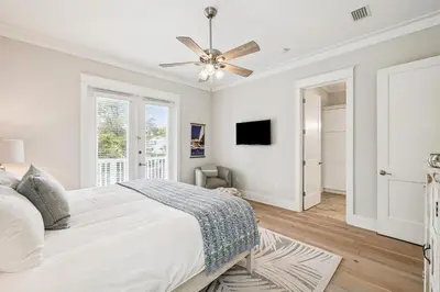 a bedroom with a bed and a ceiling fan at NamaStay by 30A Escapes in Seacrest