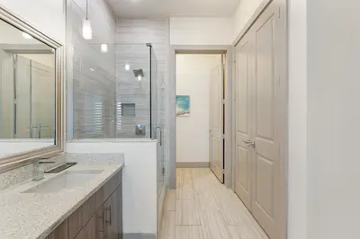 a bathroom with a sink and a mirror at The Pointe Unit 111 by 30A Escapes in Rosemary Beach