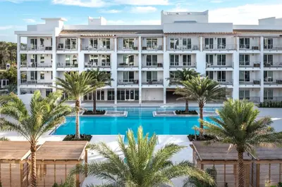 an aerial view of a hotel with palm trees at The Pointe Unit 122 by 30A Escapes in Rosemary Beach