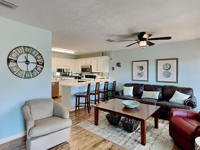 a living room with a couch and a table at Horizon South 57-105 in Panama City Beach