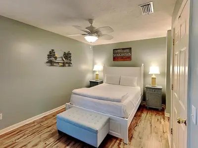 a bedroom with a bed and a ceiling fan at Horizon South 57-105 in Panama City Beach